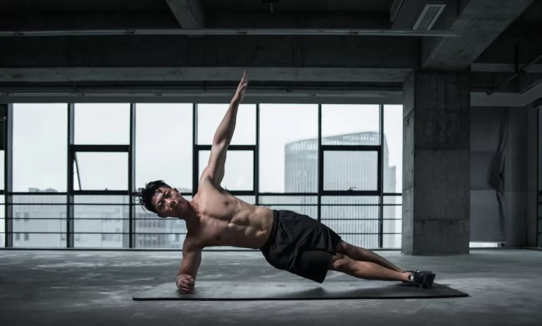 man doing side plank